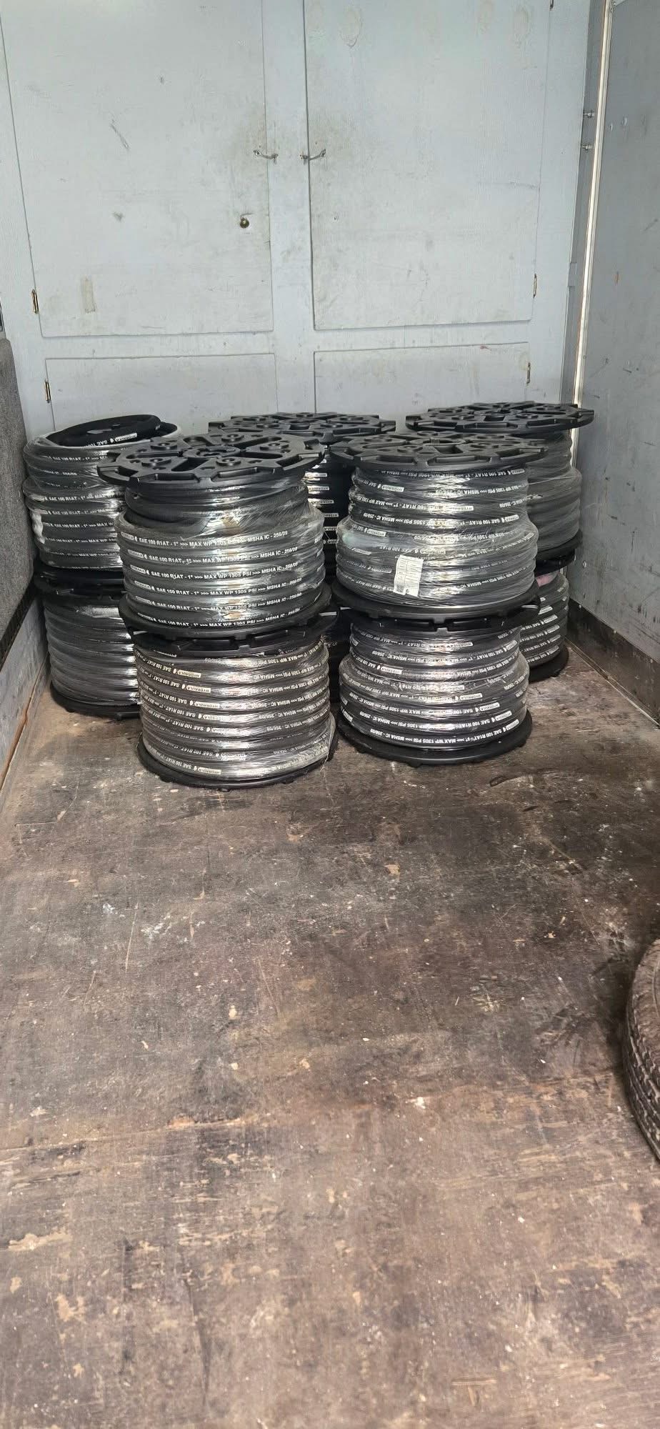 Stacked reels of 1-inch hydraulic hose